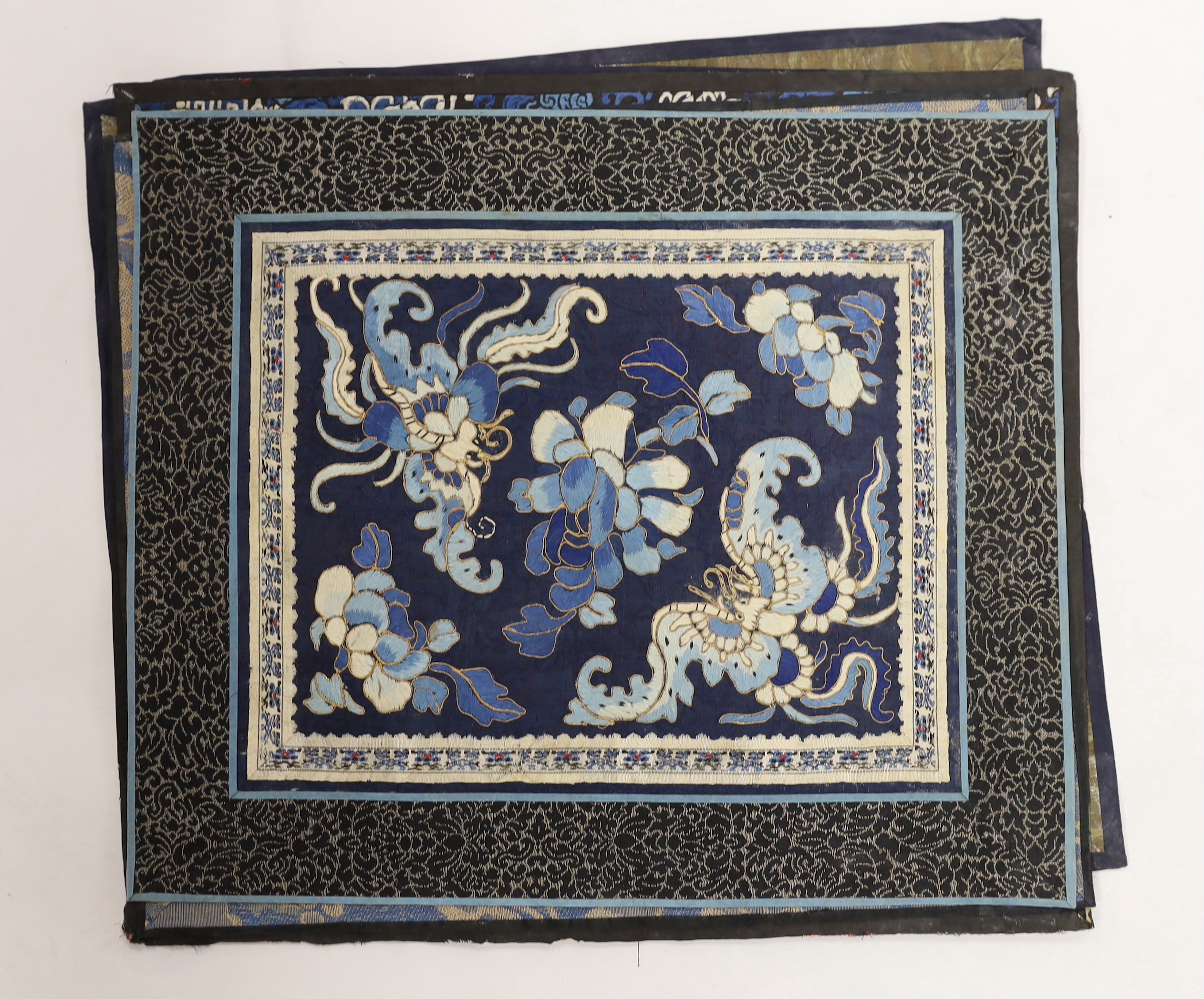 Nine Chinese silk embroidered panels, framed with silk damask borders, circa 20th century, largest 37cm x 41cm